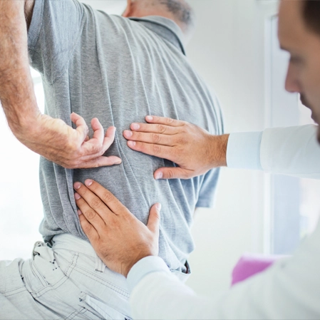 Chiropractic Denver CO Man With Back Pain